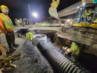 Crews installing stormwater infrastructure as part of the Exit 16 DDI Project.