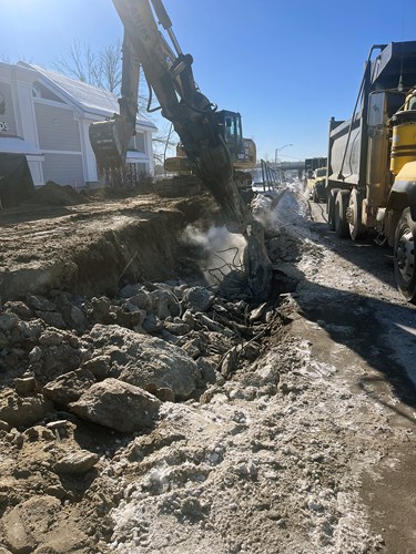 Crews work to remove the retaining wall on U.S. 2/7 just south of Lower Mountain View Drive in Colchester, VT.