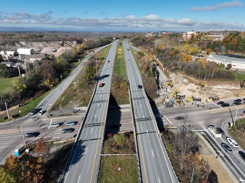 An aerial view of Interstate 89 over U.S. 2/7 in Colchester, with crews removing blasting material along the I-89 Exit 16 northbound on-ramp.