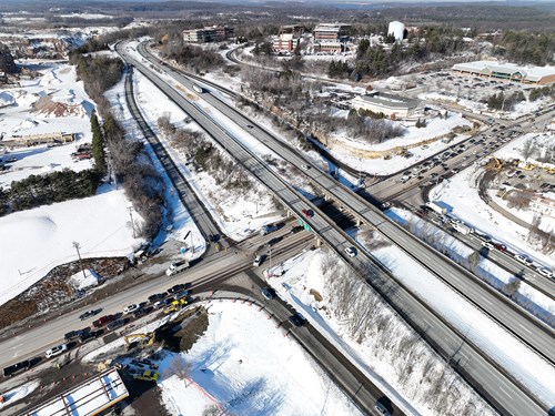 Aerial view of the I‑89 Exit 16 interchange, where crews plan to remove barriers and conduct clearing work next week.