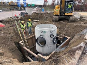 Crews install drainage infrastructure along the east side of U.S. 2/7 between South Park Drive and the I-89 Exit 16 southbound on-ramp.