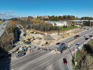 Aerial view of construction progress in October 2025. Blasting activities and ledge removal along U.S. 2/7 and the I-89 northbound on-ramp. 