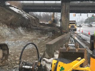 Crews continue to remove earth material to facilitate the installation of the retaining wall along the west side of U.S. 2/7.