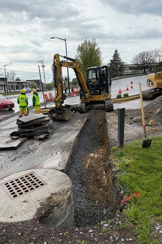 Crews install conduit sleeves for traffic signals.