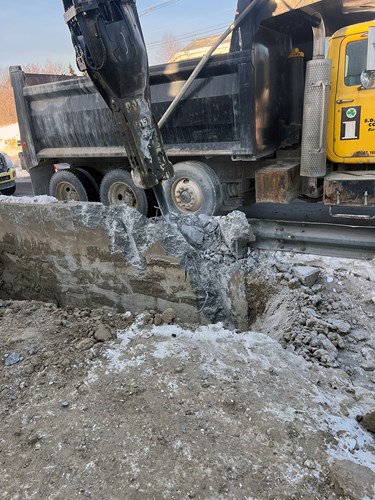 Crews continue to hammer and remove the existing retaining wall on U.S. 2/7 between Lower Mountain View Drive and The Lighthouse Restaurant in Colchester, VT.