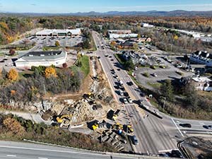 Aerial view of construction progress in October 2025. Blasting activities and ledge removal along U.S. 2/7 and the I-89 northbound on-ramp. 