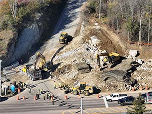 Aerial view of construction progress in October 2025. Blasting activities and ledge removal along U.S. 2/7 and the I-89 northbound on-ramp. 