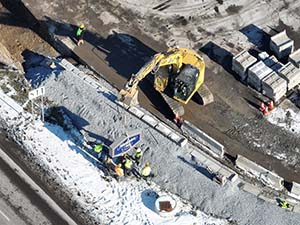 Aerial view of construction progress in December 2025. Retaining wall construction in The Lighthouse Restaurant parking lot along U.S. 2/7. 