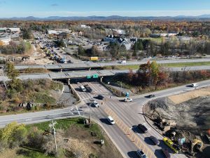 Aerial view of construction progress. Drainage infrastructure installation along the I-89 southbound on-ramp. Blasting activities and ledge removal along U.S. 2/7 and the I-89 northbound on-ramp.