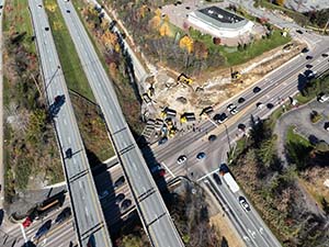 Aerial view of construction progress in October 2025. Blasting activities and ledge removal along U.S. 2/7 and the I-89 northbound on-ramp. 