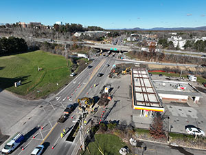 Aerial view of construction progress in November 2025. Drainage infrastructure installation along U.S. 2/7 between the I-89 southbound on-ramp and South Park Drive.