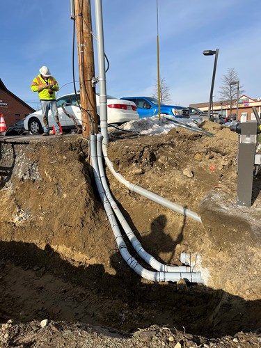 Crews document utility lines as ledge removal and underdrain installation took place along Lower Mountain View Drive in Colchester, VT.