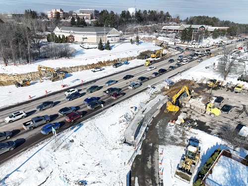 Crews construct a retaining wall in The Lighthouse Restaurant parking lot along U.S. 2/7 in Colchester, VT.