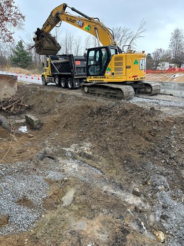 Crews conduct excavation for future drainage infrastructure along the I-89 Exit 16 southbound on-ramp in Colchester, VT.