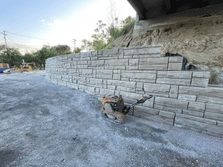 Crews continue constructing the retaining wall along the west side of U.S. 2/7 to allow for future pedestrian and bicycle facilities. 