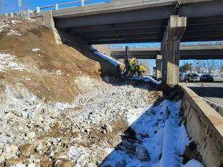 Crews continue to remove earth material to facilitate the installation of the retaining wall along the west side of U.S. 2/7.