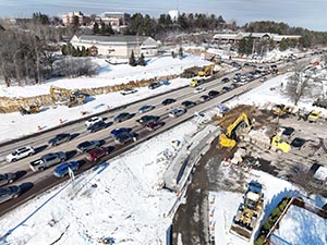 Aerial view of construction progress in December 2025. Retaining wall construction in The Lighthouse Restaurant parking lot along U.S. 2/7. 