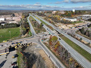 Aerial view of construction progress in October 2025. Drainage infrastructure installation along U.S. 2/7 and the I-89 southbound on-ramp. 