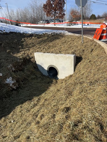 Crews install a stormwater grass channel on the south side of Upper Mountain View Drive near its intersection with U.S. 2/7 in Colchester, VT.