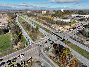 Aerial view of construction progress in October 2025. Drainage infrastructure installation along U.S. 2/7 and the I-89 southbound on-ramp. 